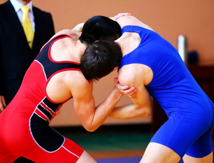 Two young men wrestle during a competition.